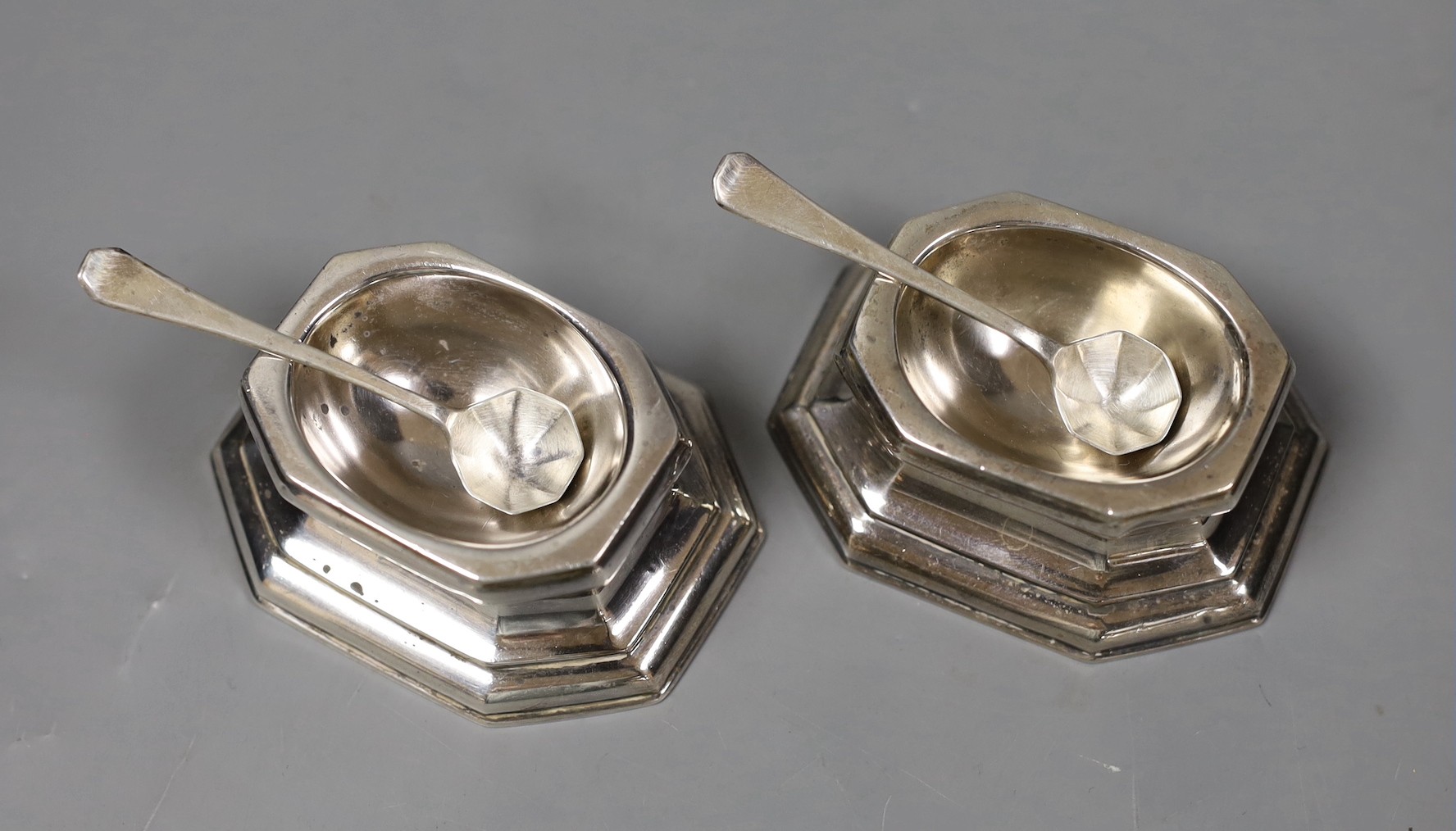 A pair of late Victorian Britannia standard silver trencher salts and pair of matching sterling silver spoons, Thomas Bradbury & Sons, London, 1897/1900, length 81mm, 140 grams.